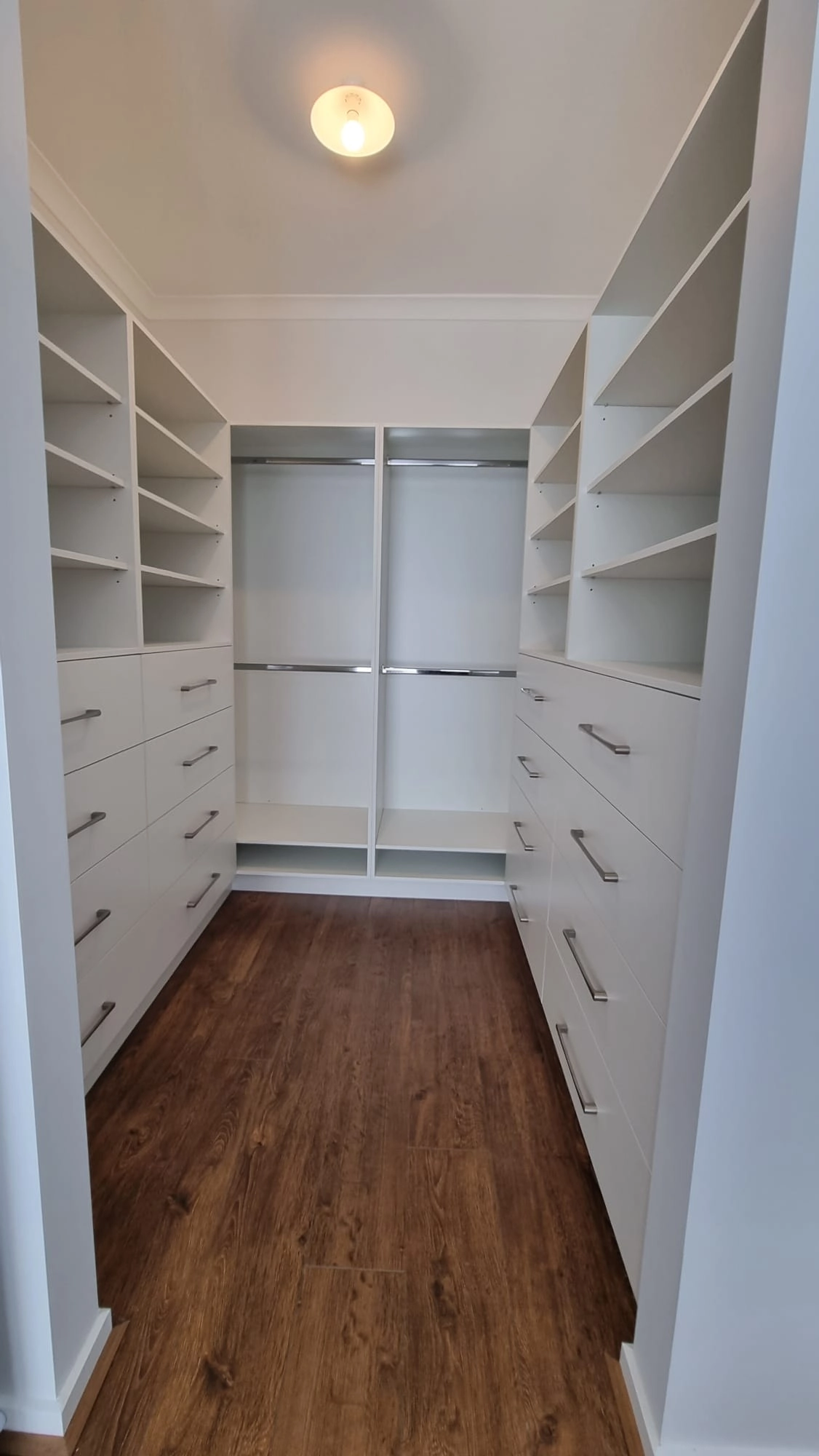 Custom walk-in wardrobe Melbourne showing full height cabinetry and integrated storage by Northside Joinery