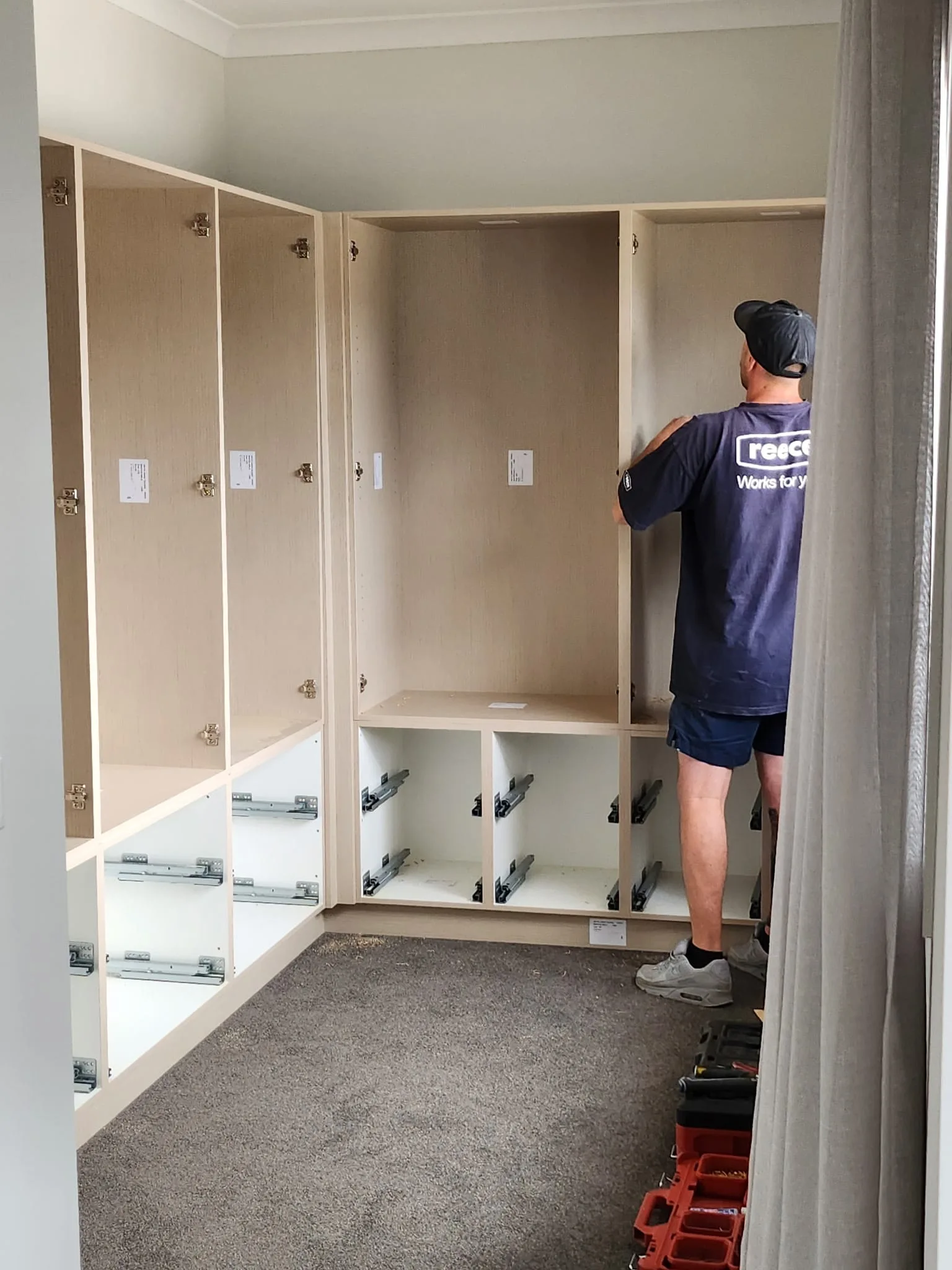 Custom walk-in wardrobe mid-installation in Melbourne by Northside Joinery, in-house build process